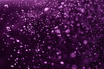 Abstract purple bokeh defocus glitter background.