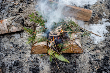 Fire up on the lake. Camping in the winter with a fire in nature