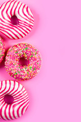 Donuts on a pink background.