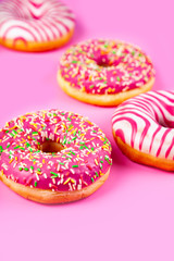 Donuts on a pink background.
