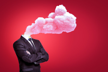 Businessman with a cloud of pink smoke instead of head on red background