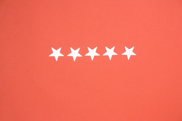 five shining stars on a coral background