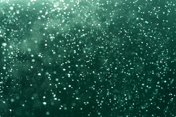 Abstract Green bokeh defocus glitter blur Background.