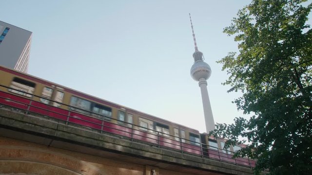 A train passes in front of the TV tower in Alexanderplatz, Berlin