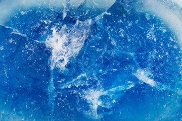 Fototapeta premium Blue ice with cracks and rifts