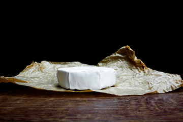 camembert with grapes on parchment