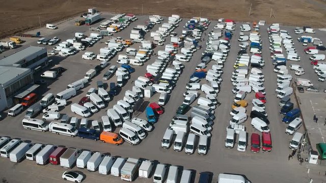 Aerial view of new cars in the parking.  imported new vehicles - outdoor parking various type cars