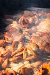 Obraz na płótnie Canvas Grilled pork intestines with smoke on stove charcoal