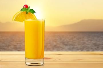Orange juice and slices of orange on background