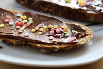 bread on white plate chocolate creme crumble mixture