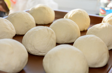 Fototapeta na wymiar Under the influence of Italian culture, pizza has gained great popularity in different countries. Pizza dough is made from flour, water and salt.