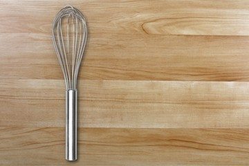 Stainless steel whisk isolated