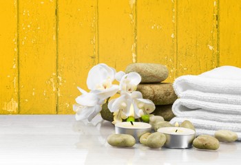Laundry Basket with colorful towels on background