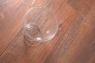Empty disposable plastic cup made of clear plastic