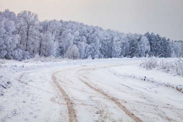Fototapeta na wymiar Country road after a snowfall.