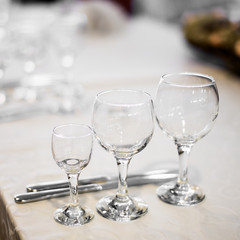 Table service in the restaurant. Transparent clean glasses and wine glasses.