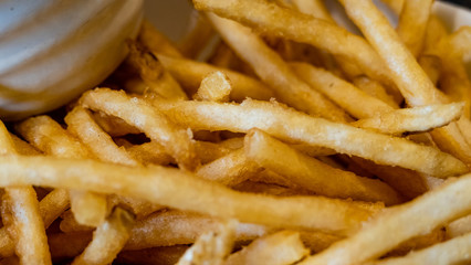 French fries in white bowl with ketchup side