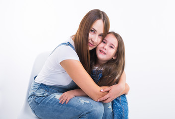 Parenting, family and children concept - Portrait of a mother and her baby girl have fun and smiling over white background