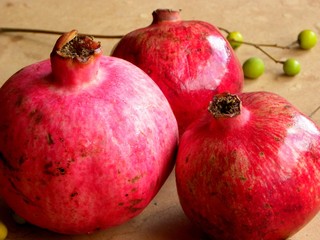 ripe red pomegranate on wooden table