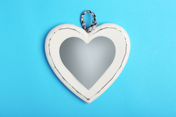 Beautiful decorative heart on color background, top view