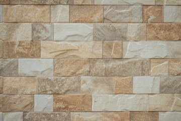 Obraz premium Featured stone tiles wall background texture. Clean and ordinary stone tile patterned.