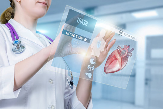 A doctor is operating with the patient digital medical card or heart treatment structure.