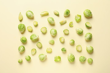 Fresh Brussels sprouts on color background, flat lay