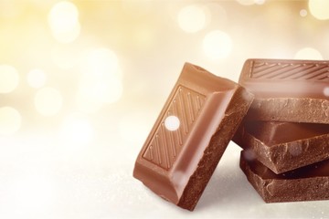 Delicious chocolates isolated on background