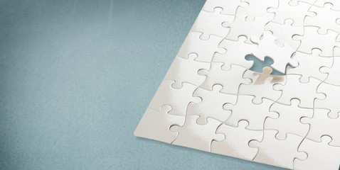 White puzzle pieces on grey background