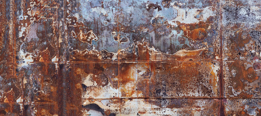 Horizontal background of old rusty burnt iron with a rough surface.