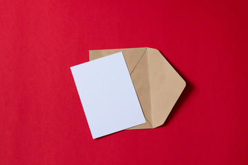 Blank white card with kraft brown paper envelope template mock up