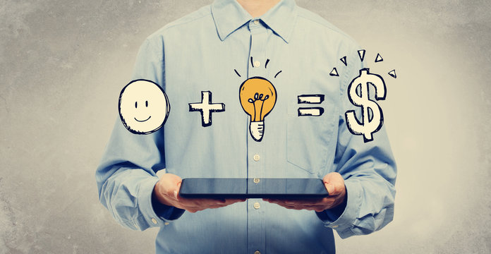 Good idea equals money with young man holding a tablet computer