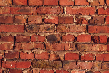 Obraz premium Background from old red bricks with cracks closeup