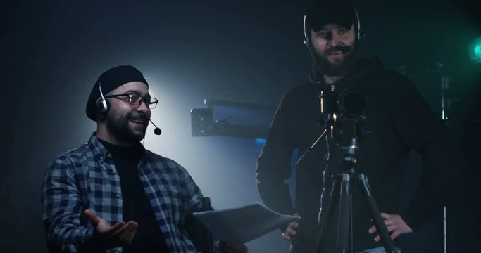 Young director giving instructions on a film set