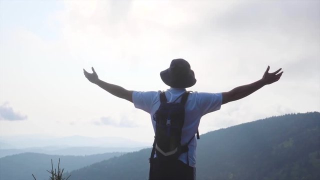 An epic shot of Nathan standing on a cliff in Tennessee.