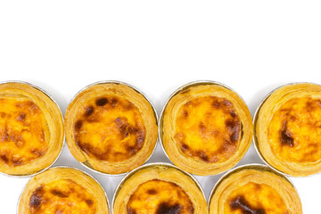 egg tart in aluminum foil cup isolated on white background