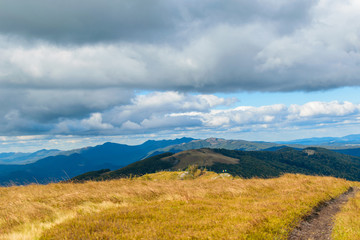 View of the highlands. Mountains with sky in the clouds.