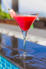 A glass of strawberry cocktail in a glass