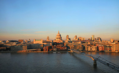 Obraz na płótnie Canvas Sunset view of St Paul's Cathedral and Millennium Bridge