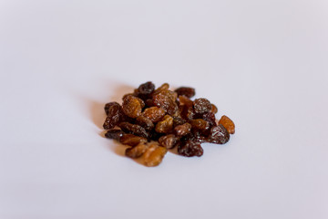 Raisins on a white background