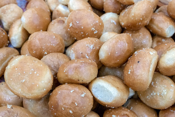 Lots of garlic buns. Background from round bakery products.