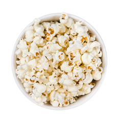 Pop corn pile in a round plate isolated on white background., top view