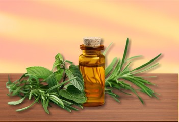 Essential Oil with Rosemary Sprig Isolated