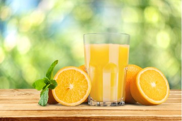 Tasty fruits  and juice with vitamins on background