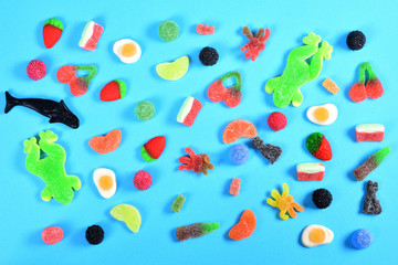 top view of jelly candies on blue background