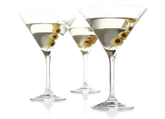 Three classic dry martini with olives isolated on white background