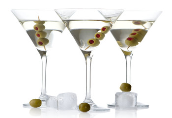 Cool classic dry martini with olives & ice cubes on white