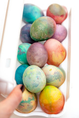 Easter painted eggs folded in plastic container