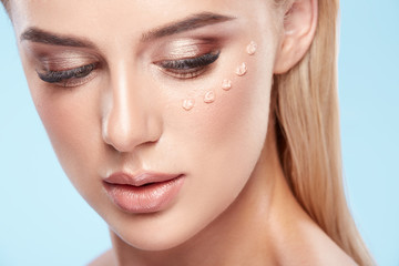 Fototapeta premium Model posing with face cream