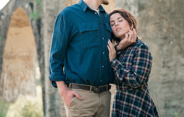 Fototapeta premium Closeup Portrait of nice lovely cute couple having fun on summer vacation. Portrait of a happy couple hugging. Summer holidays, love, relationship concept - smiling couple in mountains.